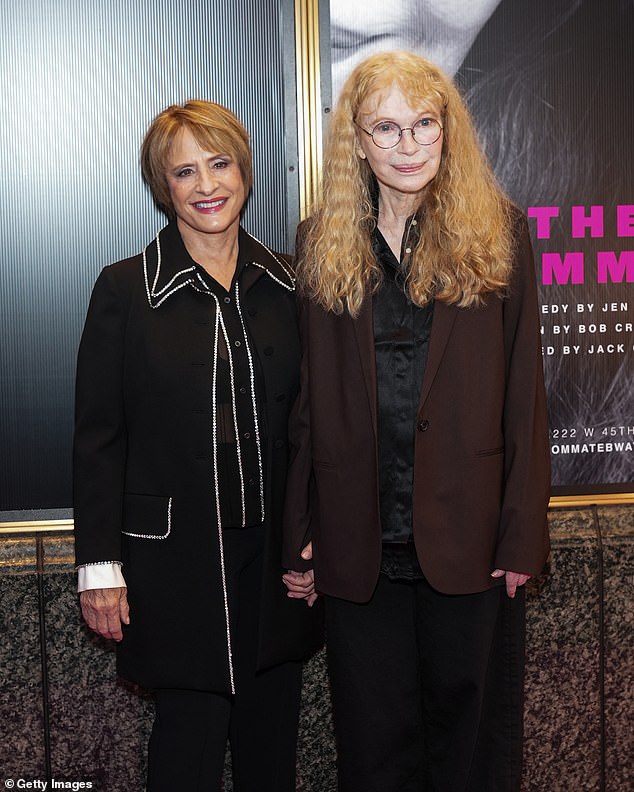 Mia Farrow stepped out in a black blouse under a brown jacket as her wavy locks fell over her shoulders