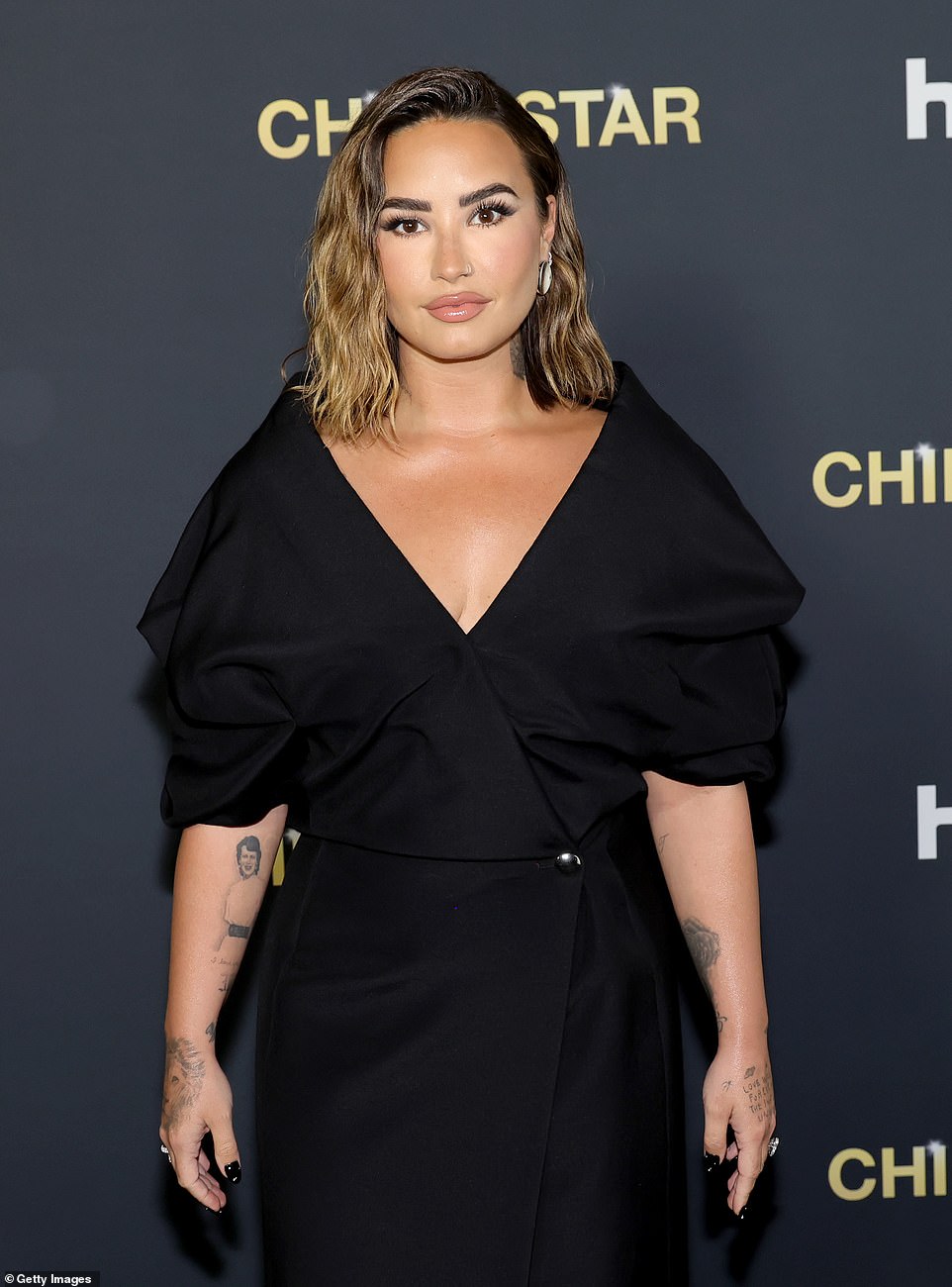 Demi's dress was cinched in at the waist, accentuating the Cool For The Summer hitmaker's enviable hourglass figure