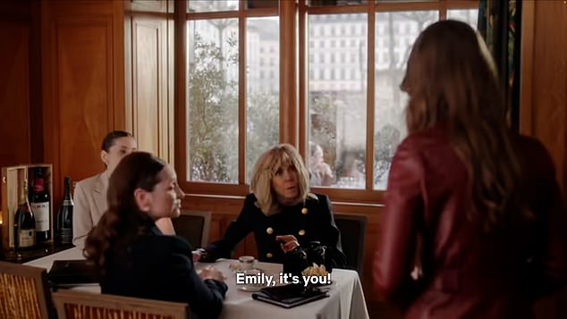 In the scene in question, Emily is sitting with her protégé (and potential love rival) Genevieve at lunch, when they see Brigitte sitting in the corner with other ladies