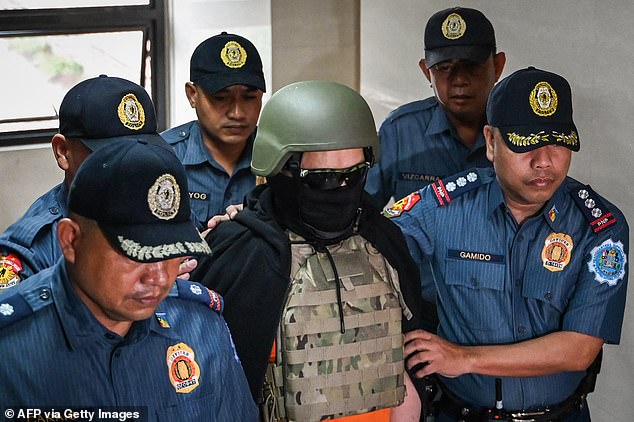 The 74-year-old was led into the heavily guarded Pasig courthouse this morning in handcuffs, wearing a bulletproof helmet and bulletproof vest