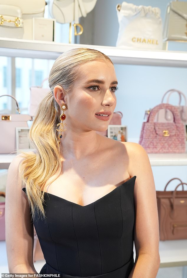 Her asymmetrical pair of Chanel earrings matched her designer handbag from the same brand