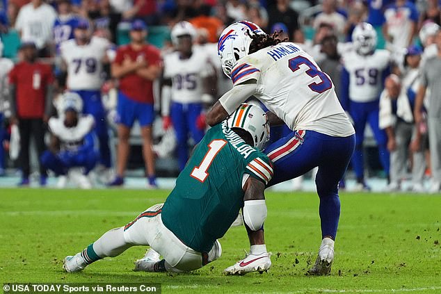 Tua Tagovailoa (left) suffered a concussion after a collision with Damar Hamlin (right)