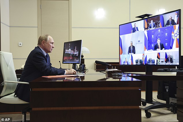 Russian President Vladimir Putin chairs a meeting with members of the Security Council via video conference at the Novo-Ogaryovo State Residence, outside Moscow, Russia, Friday, September 13, 2024.