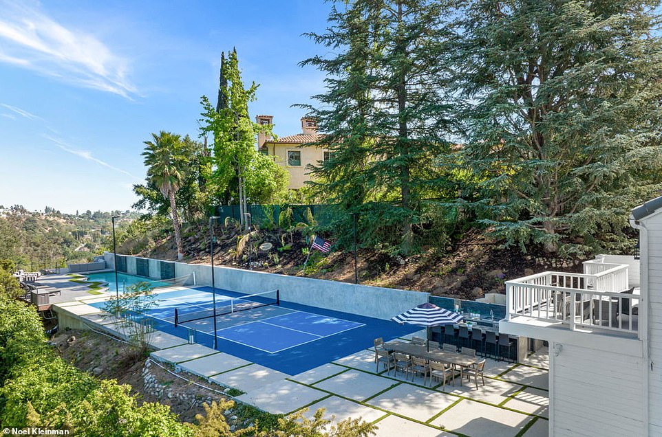 The new buyer can take advantage of the filmmaker's expansive pool, which is adjacent to a pickleball court