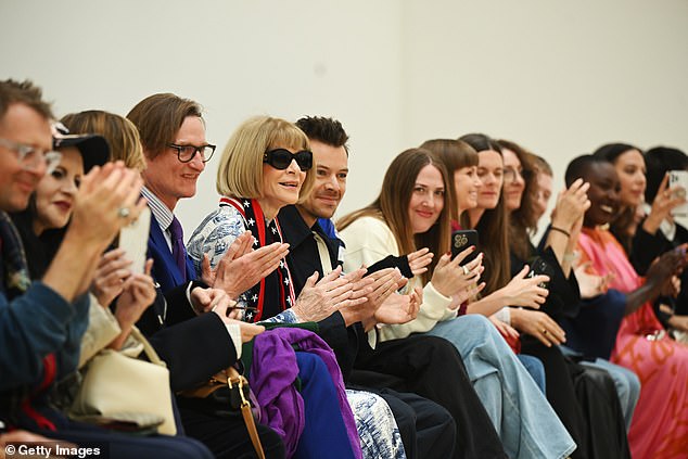 The Golden hitmaker appeared to be in high spirits as he sat front row with Vogue editor-in-chief Anna Wintour, 74, and journalist Hamish Bowles, 61, (fourth and fifth from left)