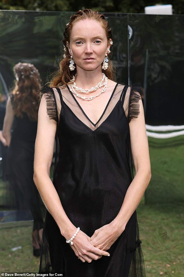 The British model, 36, wore a stunning silky black number with tulle detailing