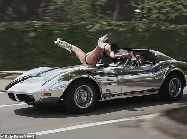 After she and her on-screen beau shed layers of clothing as they flew through the air, Perry climbed onto the hood of a chrome Corvette