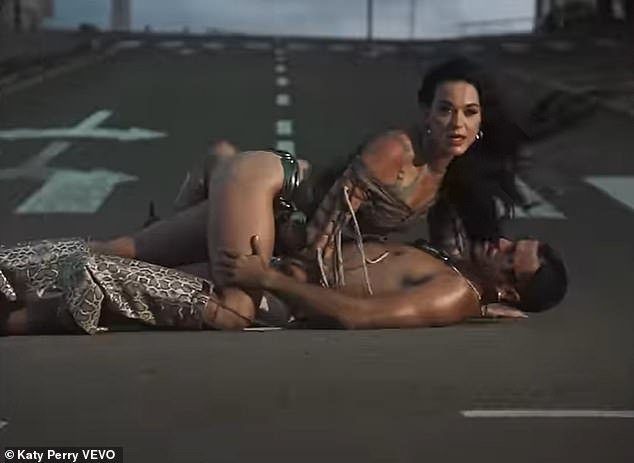 Later she and the model got naughty when she lay on top of him and he grabbed her ass in the middle of the street