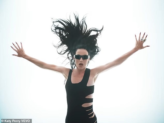 She changed clothes several times in the video, including donning a black dress with cutouts on the sides