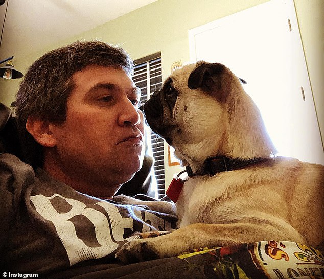 Gregory is photographed with his beloved pug Hans in a photo on social media