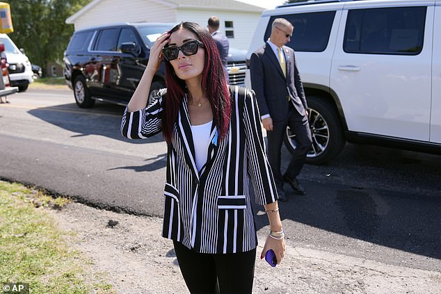 Laura Loomer arrives with Republican presidential candidate former President Donald Trump for a visit to the Shanksville Volunteer Fire Company in Shanksville