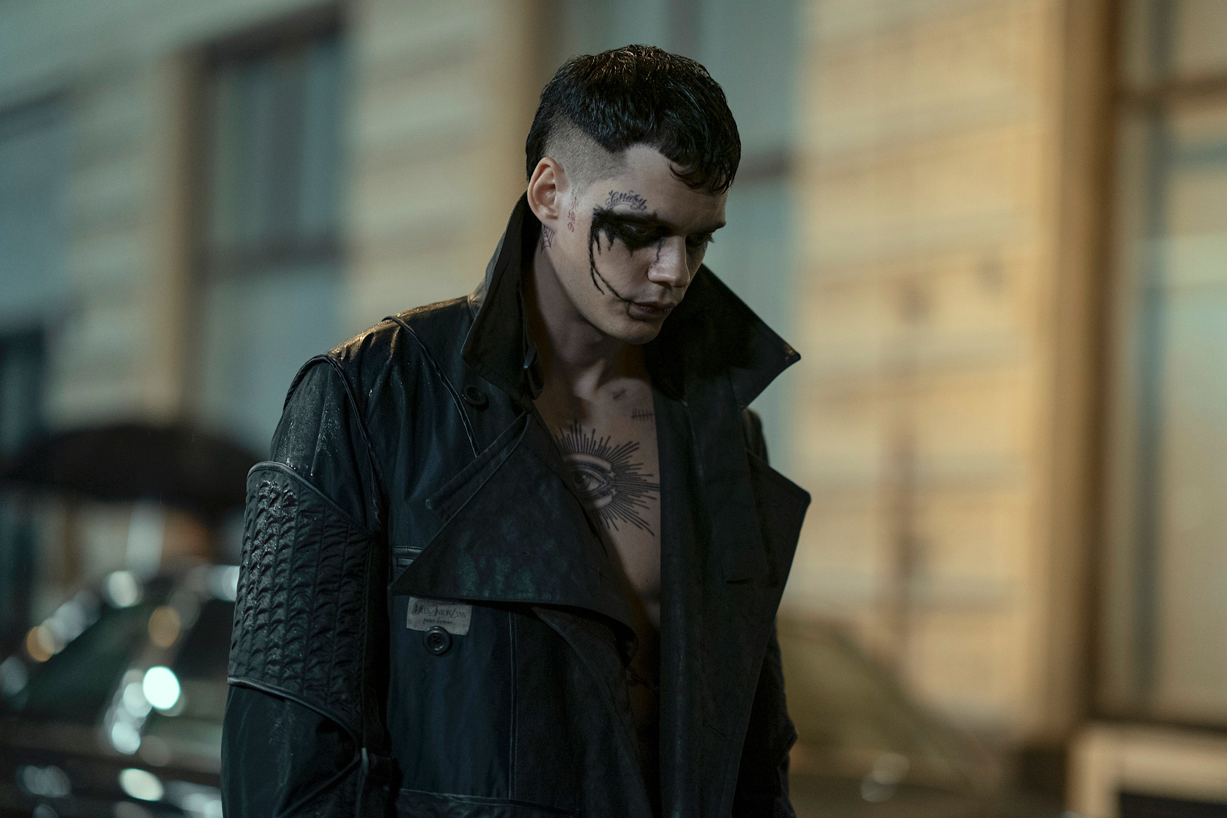 Bill Skarsgård in gothic black-and-white face paint and a trench coat, as the resurrected undead revenge seeker Eric in the 2024 reboot of The Crow