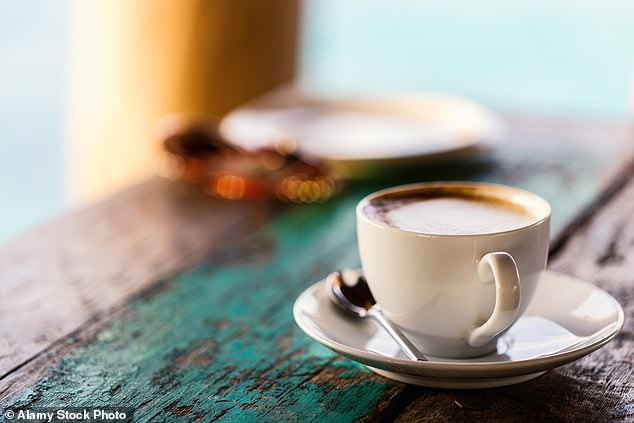 There's evidence drinking a few cups of coffee a day can protect your brain, experts say (Stock Image)