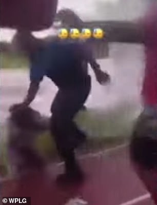 The scuffle prompted a Miami-Dade Schools police officer to intervene and pull her from a nearby crowd before throwing her to the ground