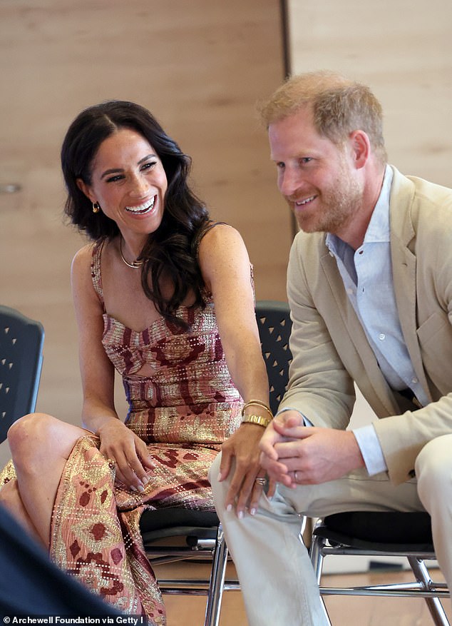 Harry and Meghan pictured last month in Bogota during a visit to the Colombian capital