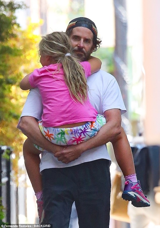 The relationship-bound father who kept it casual fashion-wise in dark pants and a white T-shirt has been co-parenting his daughter, Irina Shayk, since their split in 2019.