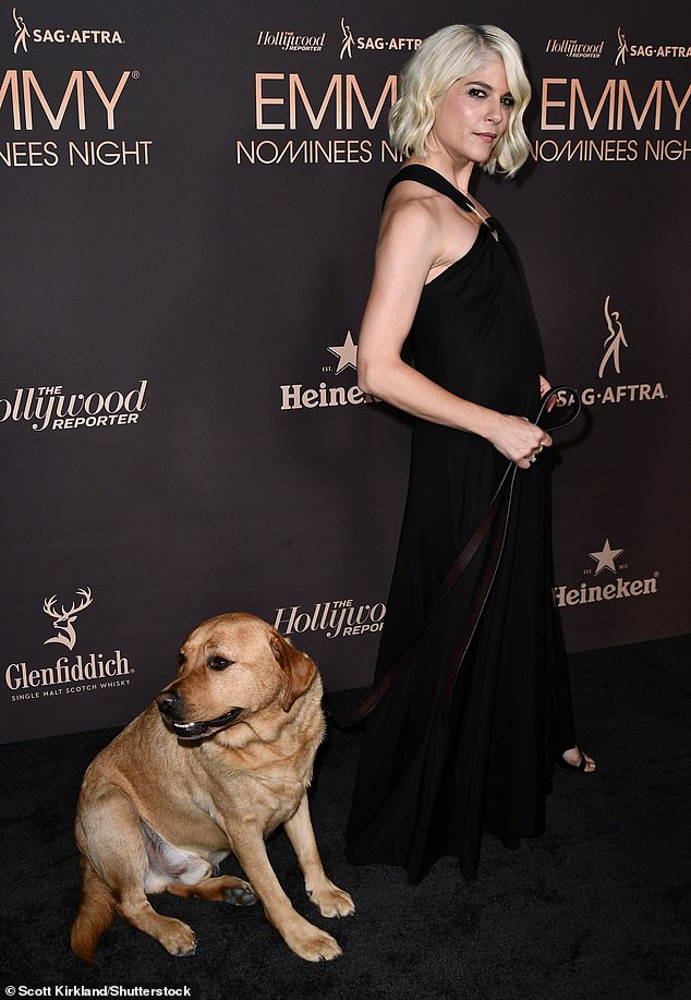 The Legally Blonde actress, who battles multiple sclerosis, wore a pair of open-toe black heels and had a big smile on her face as she was accompanied by her service dog, Scout