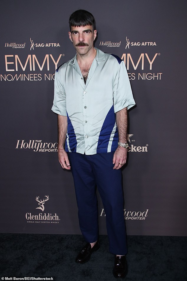 Zachary Quinto dressed to impress as he attended the star-studded event, wearing navy blue pants and a light blue satin shirt with navy stripes