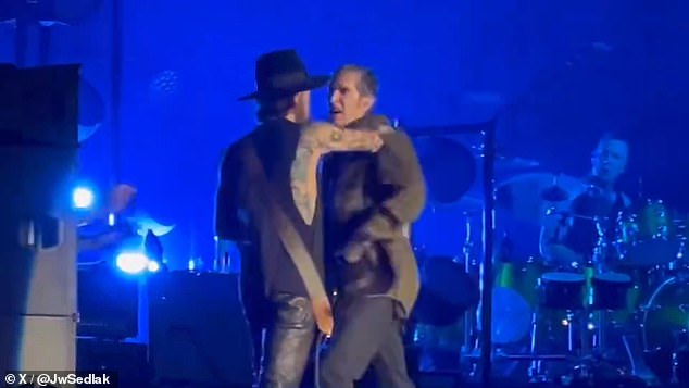 The lead singer of iconic rock band Jane's Addiction got into an altercation with the band's recently returned guitarist during a performance in Boston on Friday night