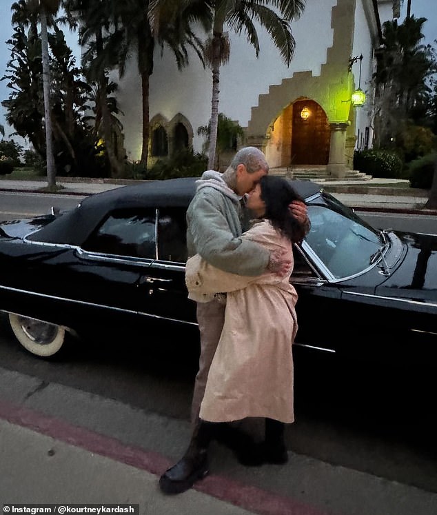 The reality star shared another snap of her and Travis posing lovingly together while standing next to a classic black car