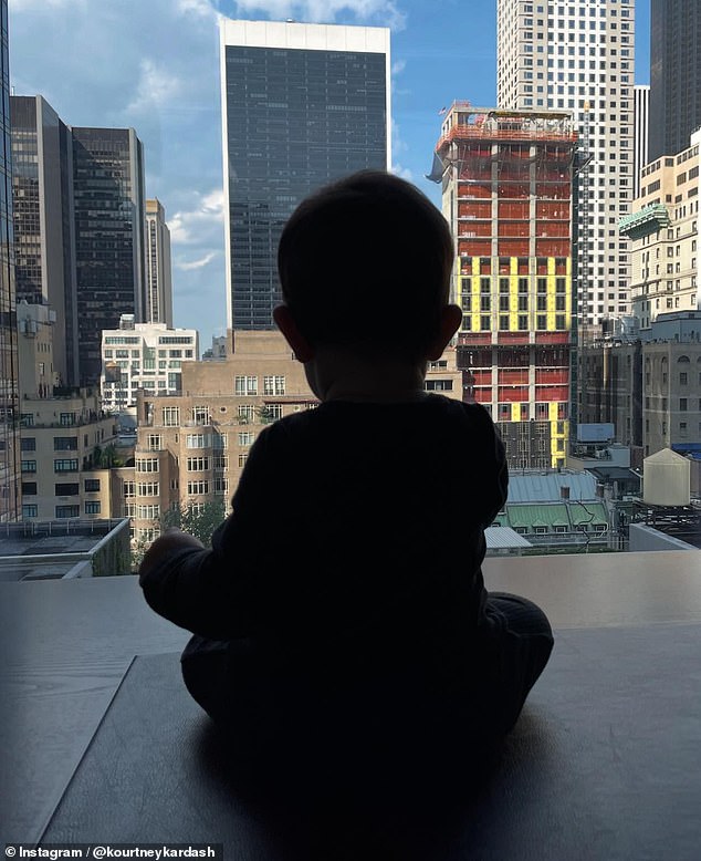 She also uploaded an adorable photo of her baby boy, Rocky Thirteen, sitting by a large window with a scenic view of the city's skyscrapers.