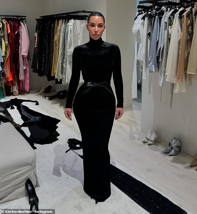 We also see the style guru wearing a bold turtleneck bodycon dress that accentuates her curves, as she poses in another closet full of designer looks