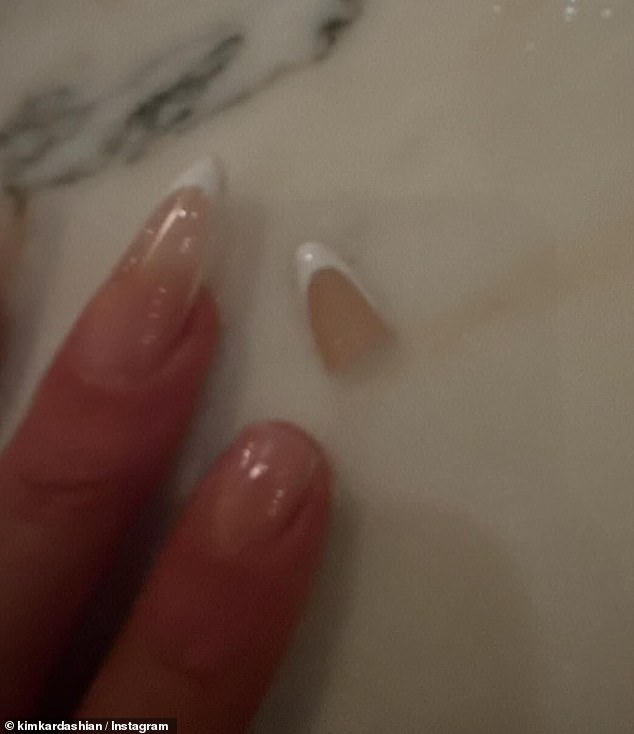 And the reality star also shared a photo of an acrylic nail of hers falling off