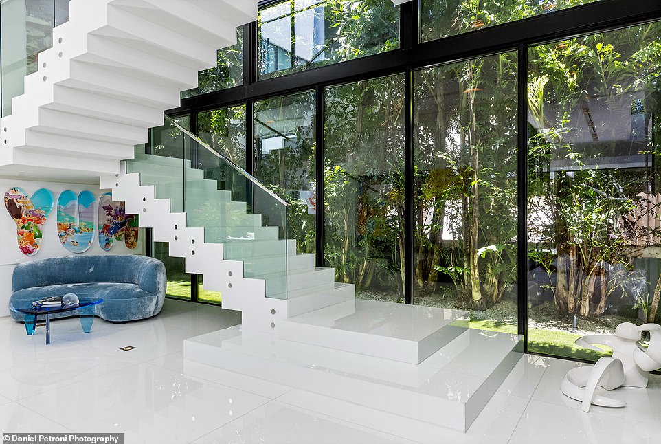 The interior of the house was designed by New York-based Jennifer Post Design and landscape architect Raymond Jungles