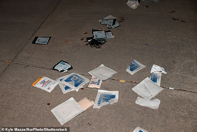 Blood, medical waste and barrier tape left at the scene of the incident