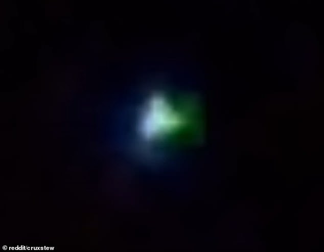 The video shows a small ball in the sky that quickly changes color