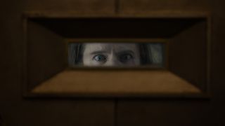 Solo peers through a mailbox shaped like a viewfinder in Silo season 2