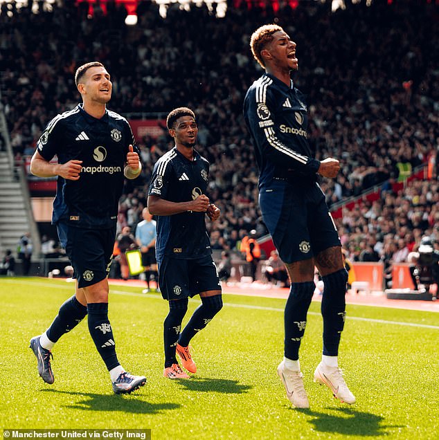 Rashford (right) celebrates his first goal for Manchester United in 189 days