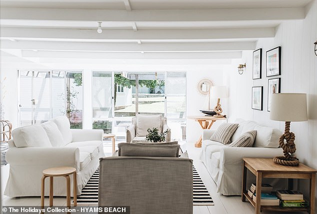 The two-story beach house is advertised as 'the perfect family vacation destination'