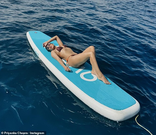 A bird's-eye view photo of the star showed more of her stunning figure as she lay on a float in the middle of the ocean