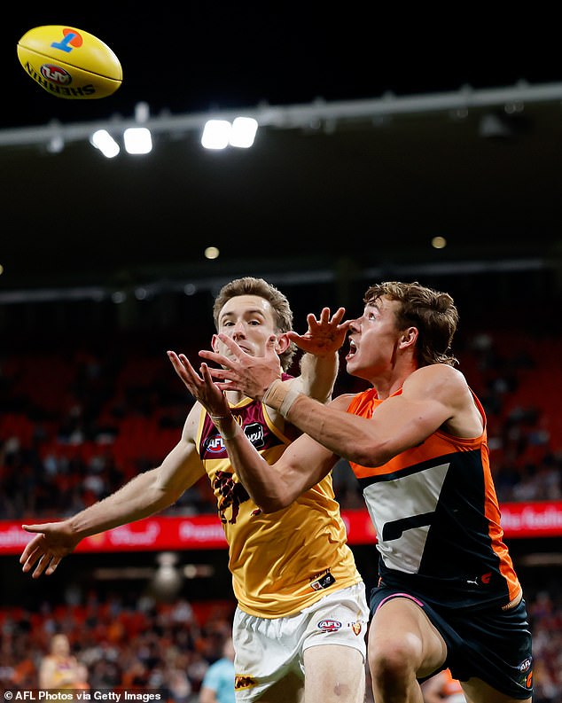 Giants' Aaron Cadman and Lions' Harris Andrews battle for the ball during the first 2024 AFL semi-final between the GWS GIANTS and Brisbane Lions at ENGIE Stadium