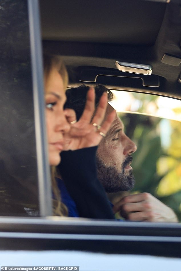 Later, as they sat in their car, Jennifer appeared to wipe away tears