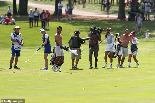 Team Europe was still preparing to take their shot, while Team USA's caddies were running around topless