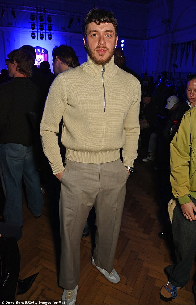 Jack Harlow kept it smart with a stylish quarter zip and taupe trousers