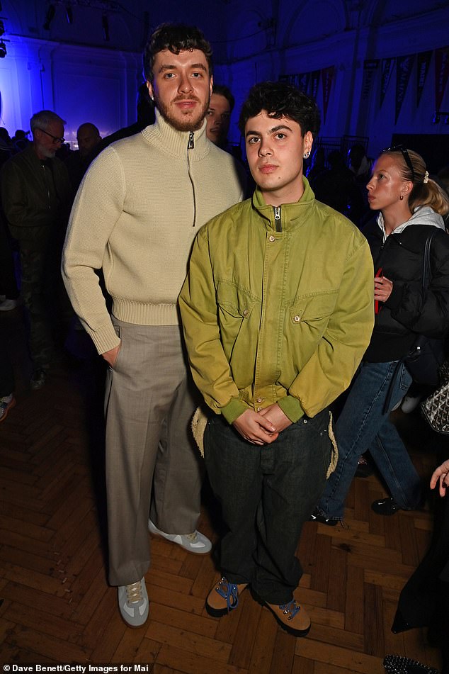 The Lovin On Me hitmaker was joined by fellow rapper Niko B who opted for a bright moss green bomber jacket