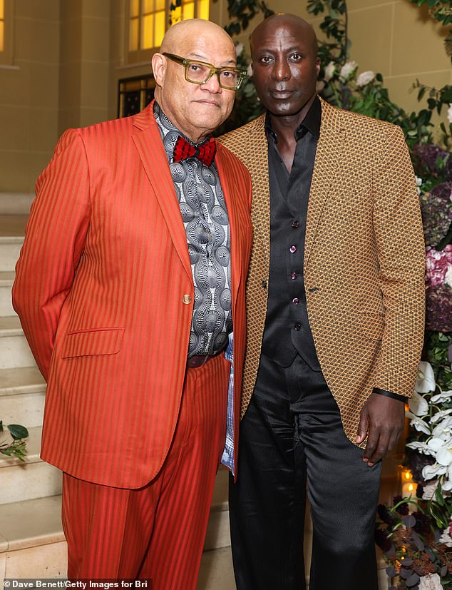 He was accompanied by English fashion designer Ozwald Boateng, 57, who looked handsome in a silk black set and a light orange and black jacket