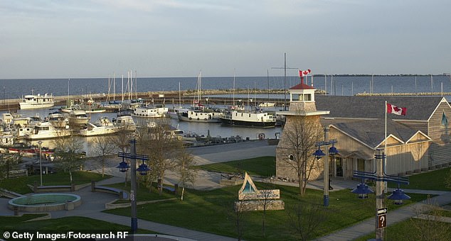 The statue overlooks the water of Gimli, a town on the shore of Lake Winnipeg