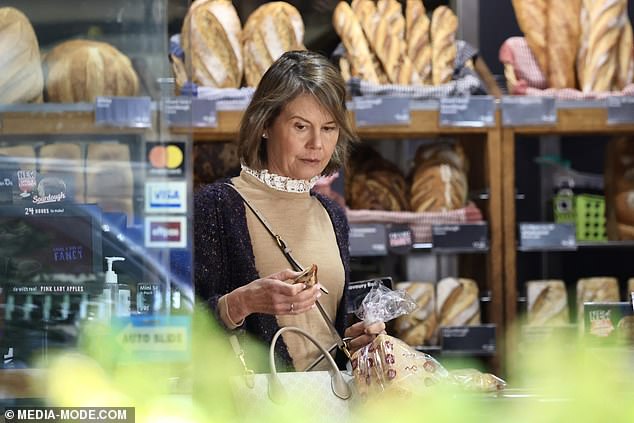 Antonia completed her look with a pair of brown boots and carried a shoulder bag as she visited a local bakery