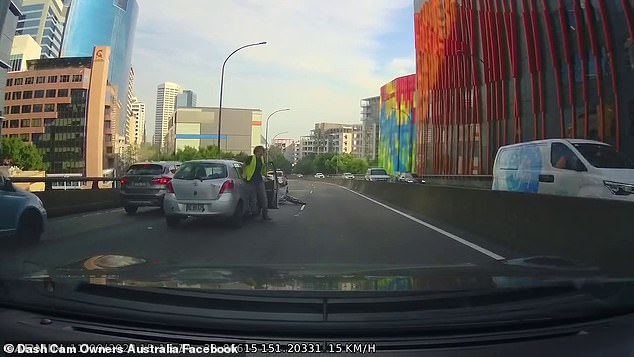 The car drove out of a lane of slow-moving traffic without warning, hitting the driver