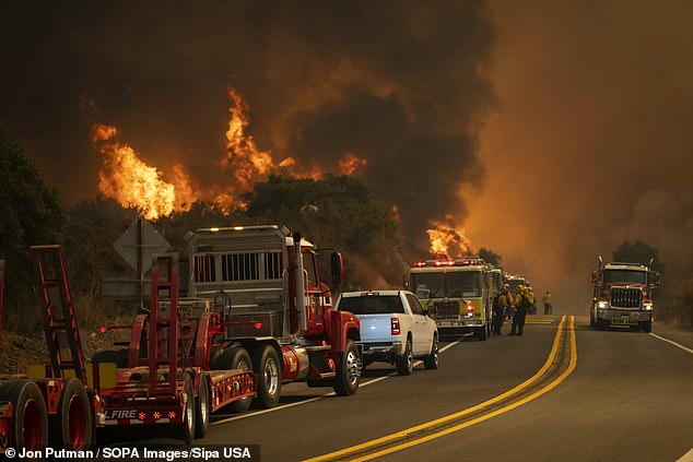 Three wildfires ravage California as emergency workers try to contain damage