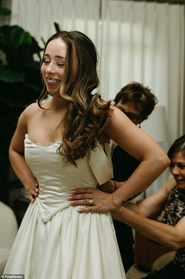 Adrian believes that two other women wore this dress first and that it may have been handmade, as it appears to have had boning and flowers added over time