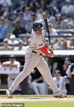 Boston Red Sox' Rafael Devers #11 gets hit by a pitch in the first inning