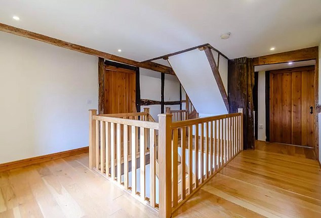 A look at the stairs and hallway in the 4,500-square-foot farmhouse — which Kevin purchased in 2021