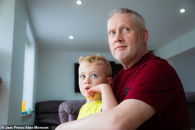 While waiting for an official diagnosis, Simon worried about whether he would be able to care for his son (pictured together) and their family