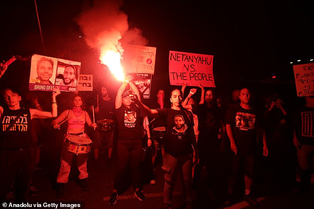 Thousands of Israelis gather with banners and Israeli flags to protest Israeli Prime Minister Benjamin Netanyahu and his government for not signing the Gaza ceasefire agreement and to demand a hostage exchange deal with Palestinians in Tel Aviv, Israel on September 14, 2024.