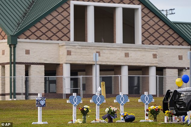 A memorial has been erected outside Apalachee High School following the horrific shooting that left parents flooding 911 call centers